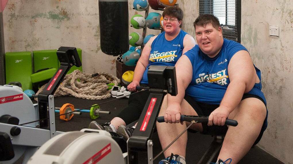 Mary Reid and Kevin Moore go head to head on the rowing machines in The Biggest Loser House prior to Mary’s elimination. Pictures: NETWORK 10