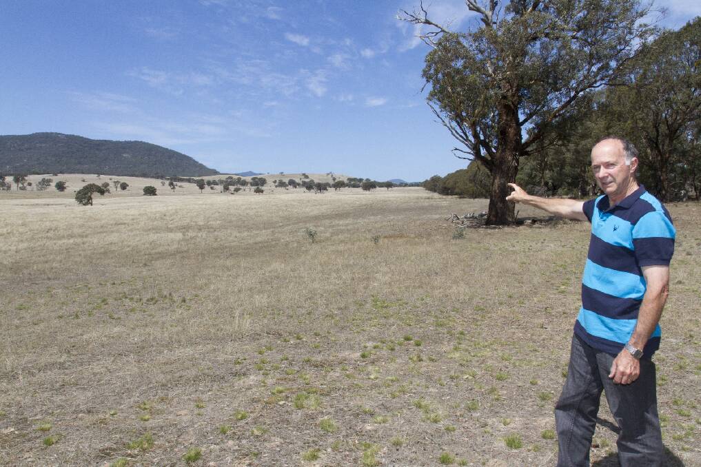 Russell Pearse points out where he believes the proposed highway will destroy
the environment. Picture: PETER PICKERING