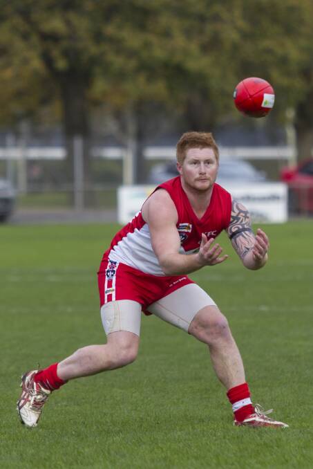 Ararat defender Peter Thompson keeps his eye on the ball during last Sunday’s win over Stawell. Thompson has been one of the Rats’ most consistent performers, named in the best in all ﬁve of his senior matches this season.