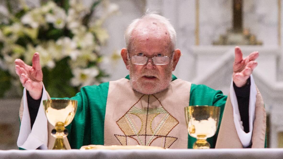 Father Brendan Davey celebrates Mass in front of 350 parishioners and friends at the Church of the Immaculate Conception last Sunday.