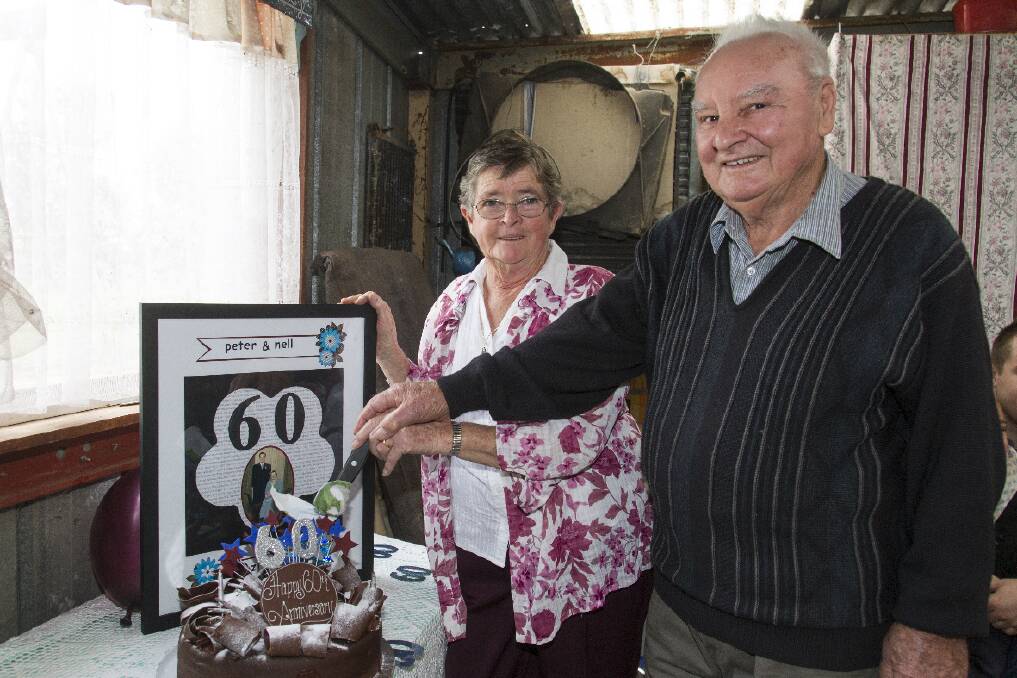 Ararat’s Peter and Nell Marshall celebrated their 60th wedding anniversary. Friends and family gathered to celebrate the Diamond anniversary and the couple are pictured here cutting their anniversary cake. Picture: PETER PICKERING