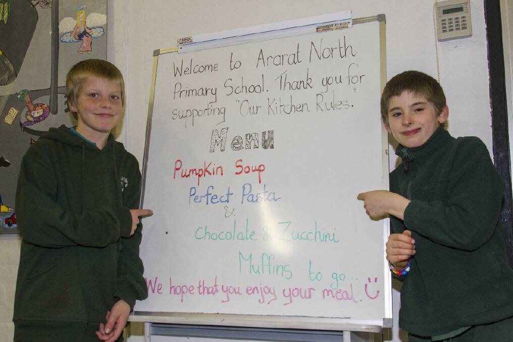Michael and Rohan point out the night’s menu for Ararat North’s Our Kitchen Rules, which was held last Tuesday to celebrate the Stephanie Alexander Kitchen Garden Program.