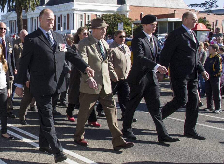 Proudly marching side by side in the Ararat Anzac Day march were three generations of the one family, L-R, Colin Graham, Athol Graham, Giles Graham and Russell Graham. Picture: PETER PICKERING