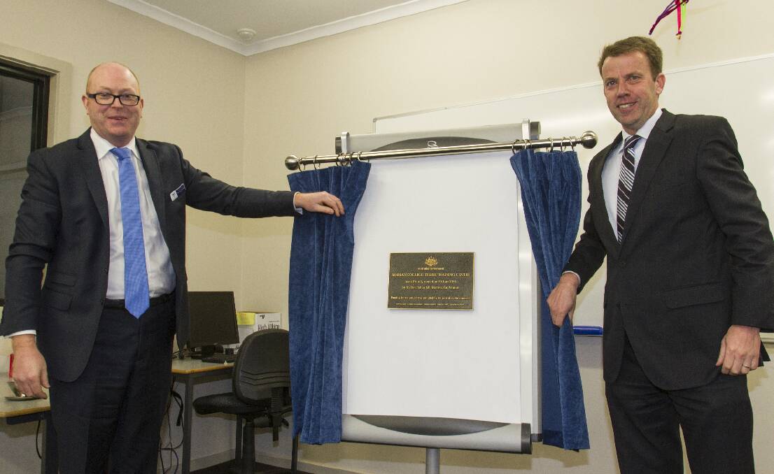 Marian College principal John Crowley and Member for Wannon Dan Tehan unveil the plaque to open the Trade Training Centre.