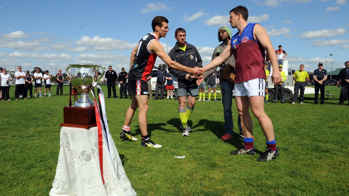 BIG GAME: Alex McRae and Jeremy Hartigan shake hands before the 2015 Wimmera Football League grand final at Anzac Park.