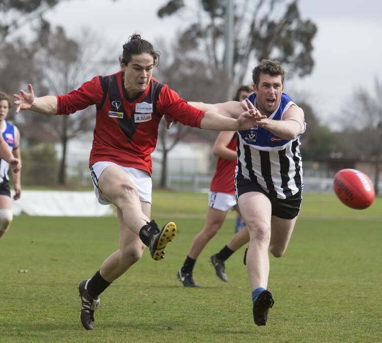 KICK: Stawell Warriors' Ethan Marrow gets a kick away against the Minyip-Murtoa Burras in the second semi-final at Stawell. Picture: PETER PICKERING
