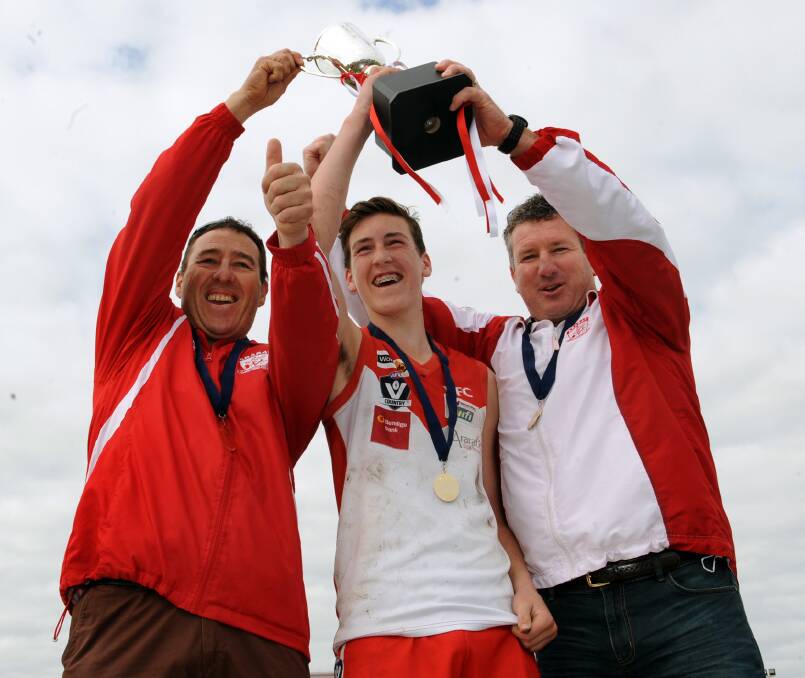 DOUBLE CHANCE: Marty McKinnis, Baydn Cosgriff and Mick Driscoll celebrate the Rats' under-14 premiership in 2015. Picture: PAUL CARRACHER