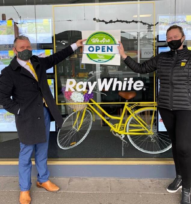 STILL OPEN: Ray White Ararat employees Mel Jones and Adam Walker. Picture: CONTRIBUTED 