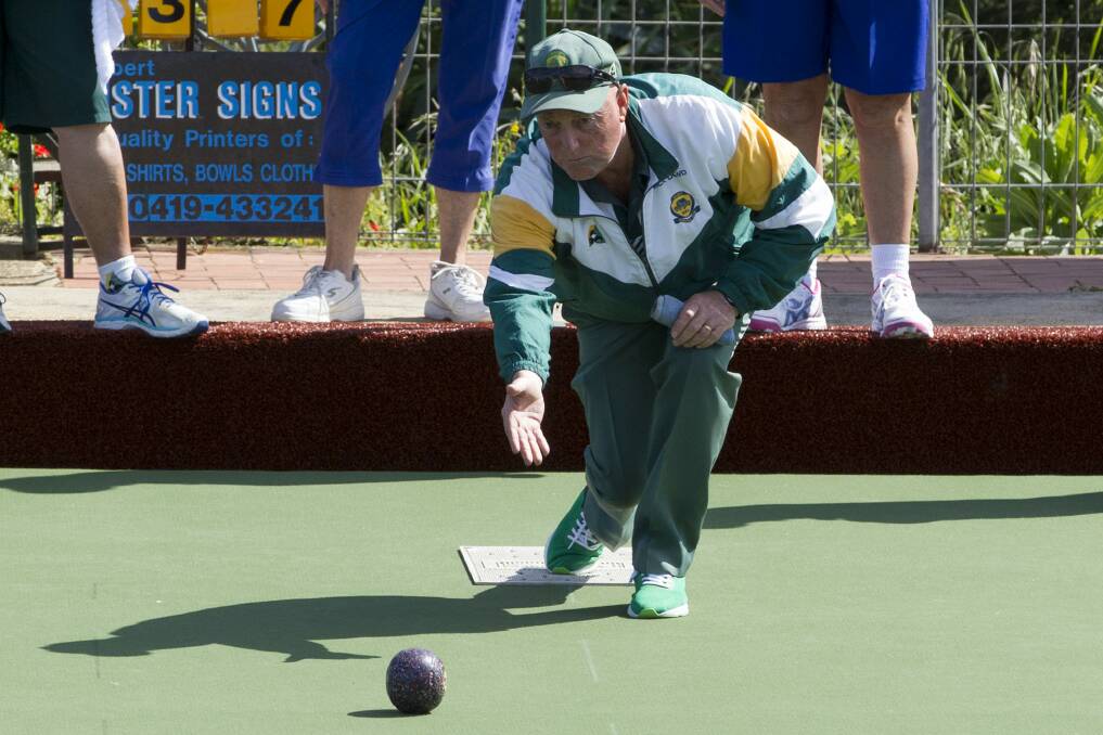 TARGET: Mick Dowd sends one down the green during a Grampians Bowls Division game. Photo: PETER PICKERING