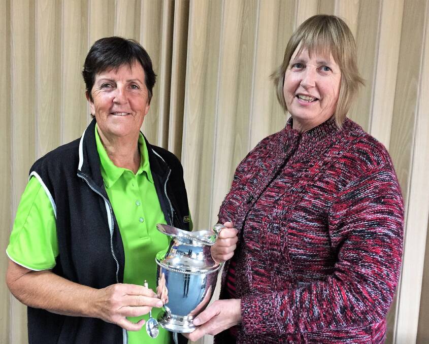VICTORIOUS: President Lyn Faneco presents Gayle Dadswell with the 2018 Royal Melbourne Trophy. 