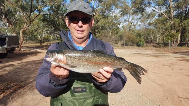CATCH: Stephen Fenwick, with his 47cm rainbow trout.