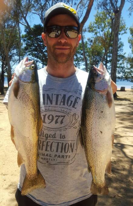 WIN: Damien Keirl, with two prime Lake Fyans' rainbow trout.