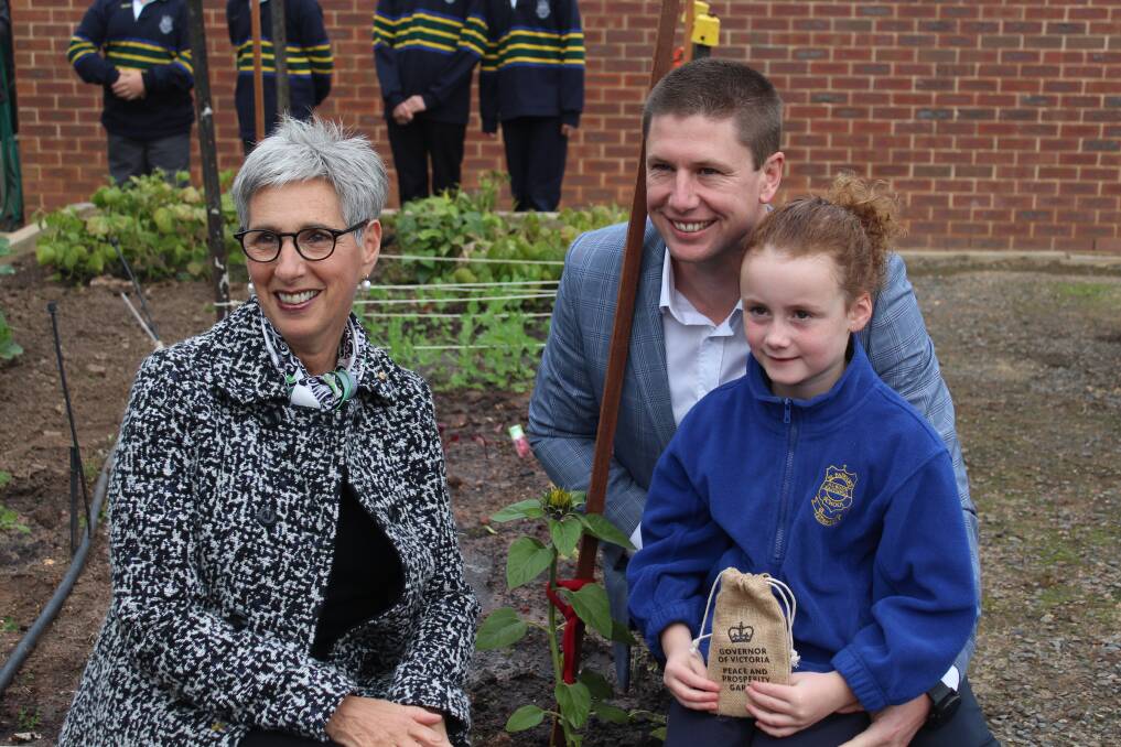 NURTURING NATURE: Governor of Victoria Linda Dessau visits the school garden with Northern Grampians Shire CEO Michael Bailey and Mia Bailey. The garden features sunflowers from the Governor's own collection.