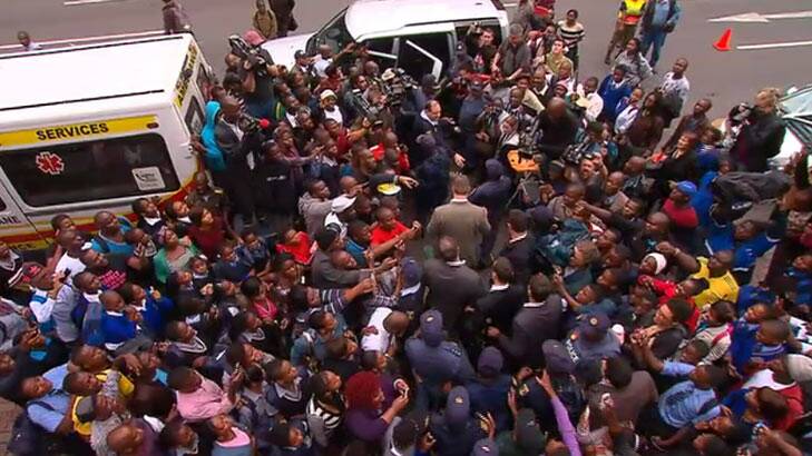 Crowds swarm Oscar Pistorius as he leaves court. Photo: Channel Seven