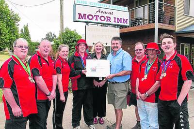 Cheryl Stapleton watches as Jonathon presents Ian Wilson with a sponsor�s certificate in front of the team Les, Damian, supervisors Loretta Miller and Colin Prior, Milton and Chris. Picture: PETER PICKERING