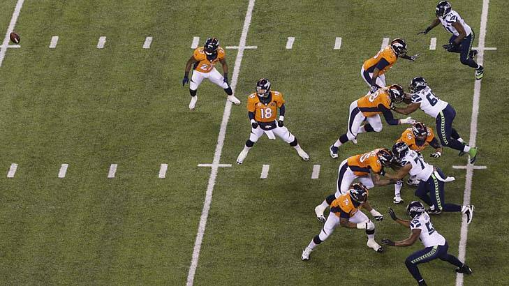 Error: the ball flies past  Peyton Manning towards the end zone. Photo: AP