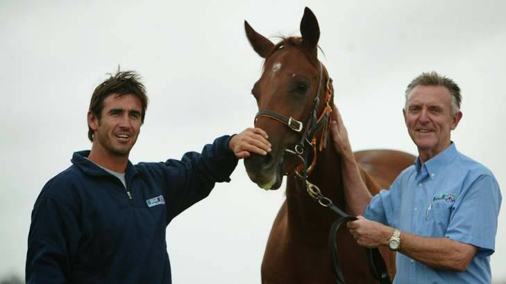 Return: Col Keane, right, pictured with Knights Eagle and rugby league legend Andrew Johns in 2004, will return to NSW racing for the first time in three years on Saturday. Photo: Peter Stoop