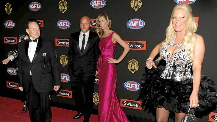 Dr Geoffrey Edelsten (left) waits for his wife Brynne (right) on the red carpet at Crown on Brownlow night.