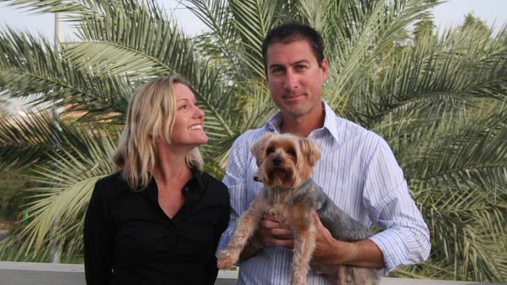 Marcus and Julie Lee in Dubai, with their dog Dudley. Photo: Supplied