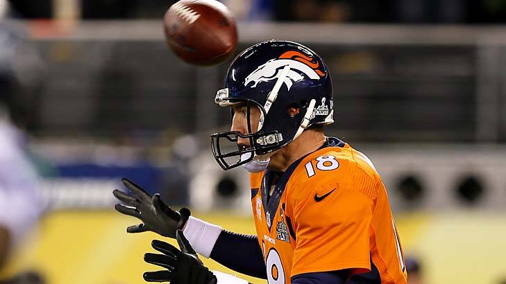 Shocking start: the ball flies over the head of quarterback Peyton Manning. Photo: Getty Images