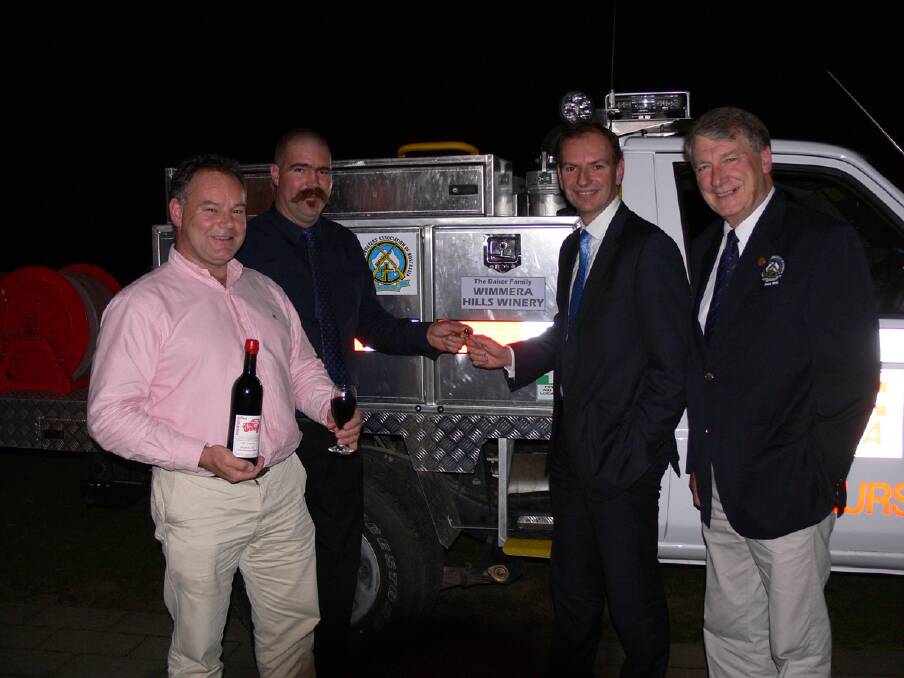 Ben Baker from Wimmera Hills Winery, Elmhurst Fire Brigade Captain Jonathan Keith, Parliamentary Secretary for Police and Emergency Services David Southwick and Bob Cooper from the Sporting Shooters Association at the hand over of the new vehicle.