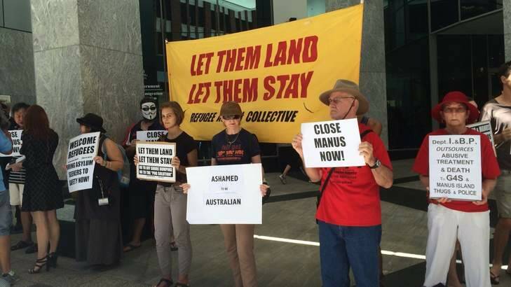 Protesters outside the Department of Immigration's Brisbane office call for the closure of the Manus Island detention centre. Photo: Cameron Atfield