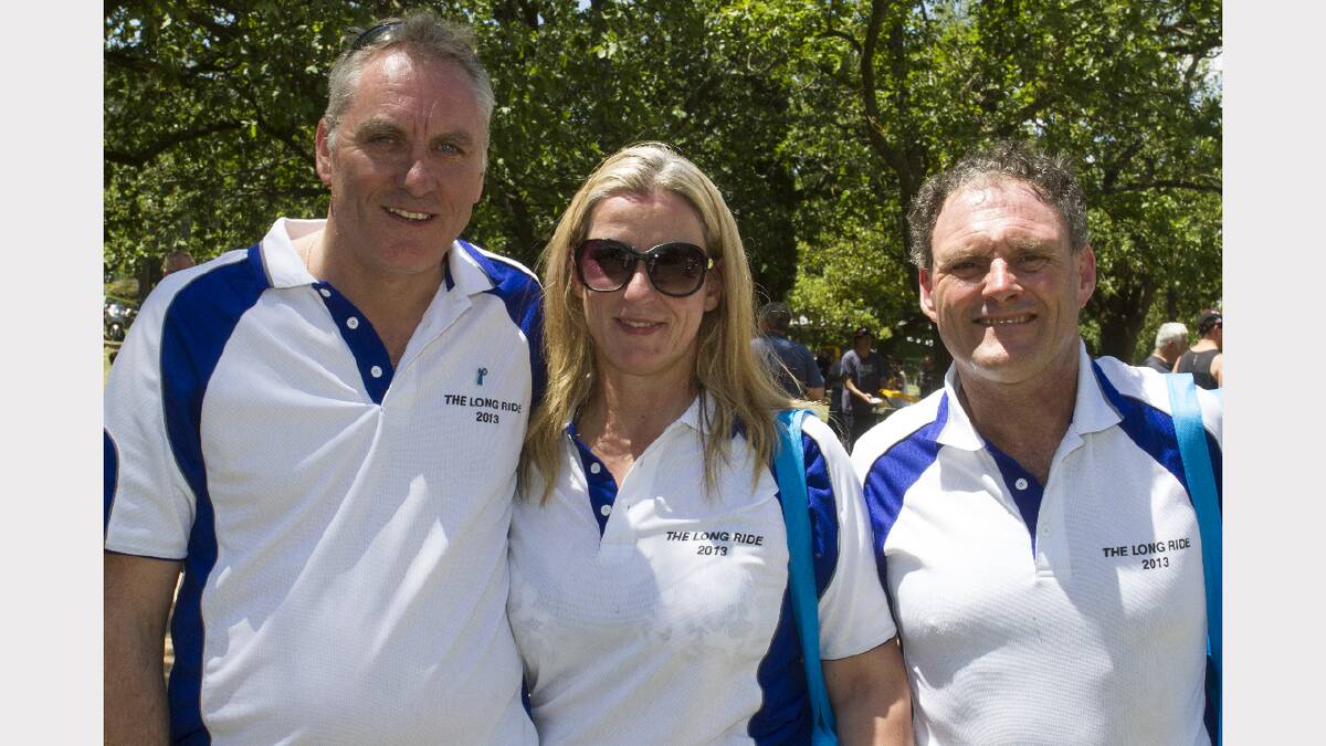 Melbourne riders Shaun Donnelly, Liz Brown and Andy Holman cool off in the gardens.