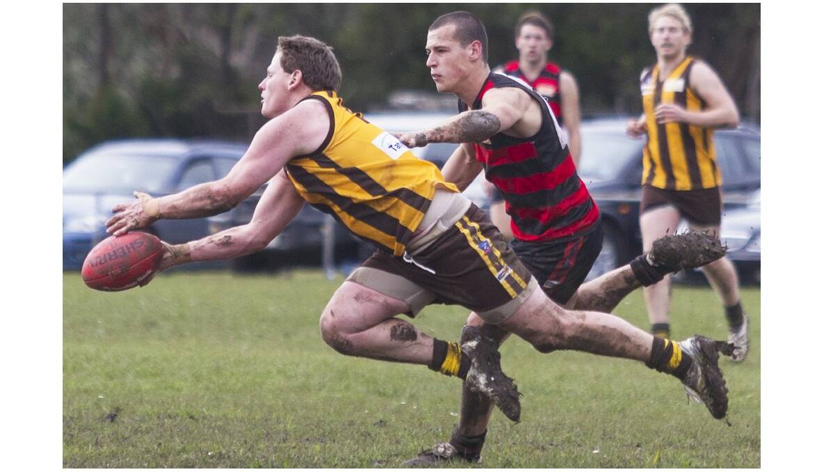 Tatyoon’s Andrew McDougall tries to outmanoeuvre his Penshurst opponent during the Hawks second semi final clash at Hawkesdale on Saturday. Picture: PETER PICKERING.
