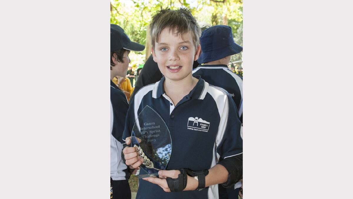 Stawell West's Sam witha trophy for winning the cart sprints.