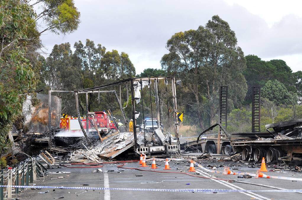Two dead, one seriously injured in a horror smash involving three trucks on the Western Highway east of Stawell late on Wednesday night. Picture: BEN KIMBER